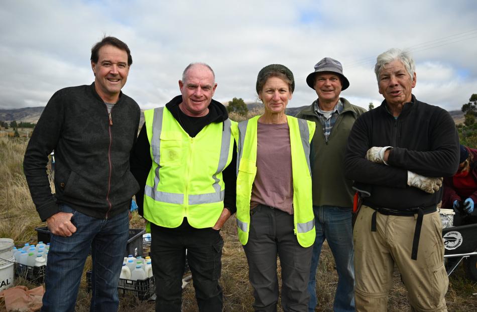 Getting stuck in are Mōkihi Reforestation trustees (from left) Blair Walter, Richard Lord, both...