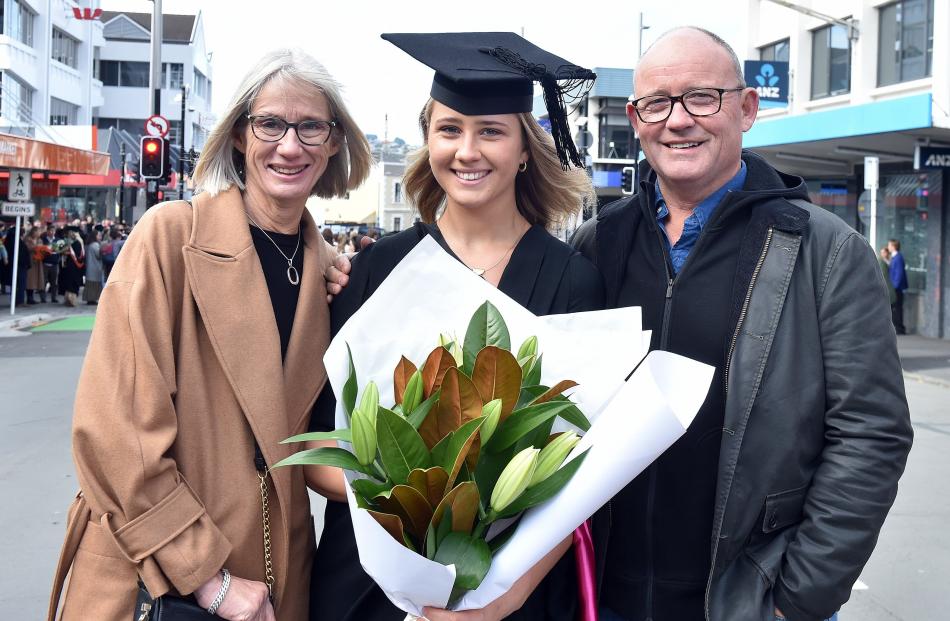 Graduand Kate Boyd (masters in nursing) with parents Trudy Penny and Dougal Boyd, all of...