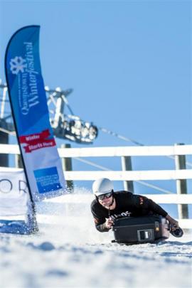 Ross Murdoch, of Queenstown, shows poise as he slides to victory in the men's race.