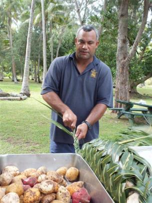 Preparing food for a lovo, the Fijian version of a hangi.