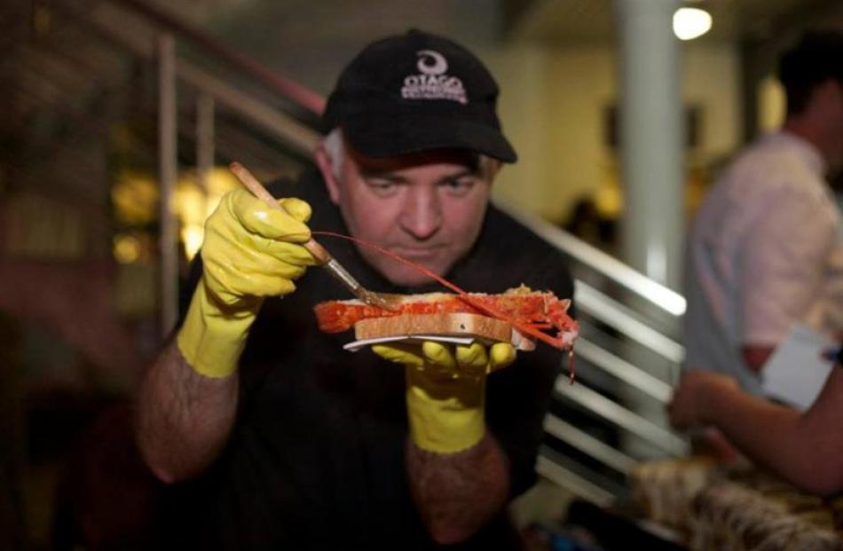 Butter is brushed on to local crayfish. Photos by Fifi Leong.