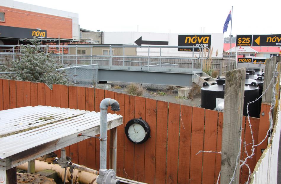 Looking over the fence abutting the Hillside Rd footpath to the former Dunedin Gasworks...