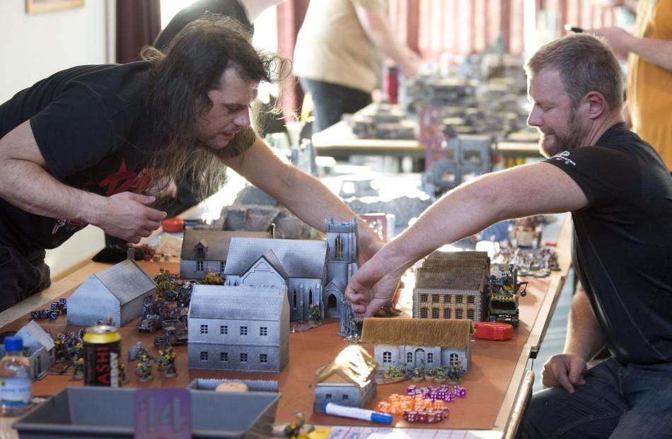 Zach Neal (left), of Christchurch, and Aidan Haig, of Oamaru, play Warhammer 40,000 at the...