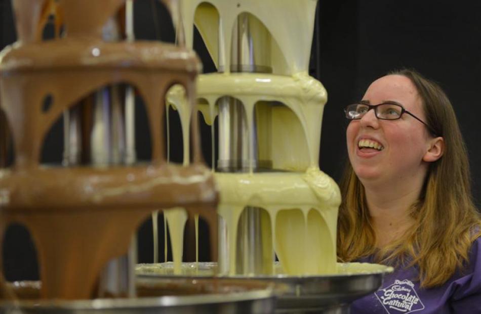 Lauren Hunter works on one of the chocolate fountains.