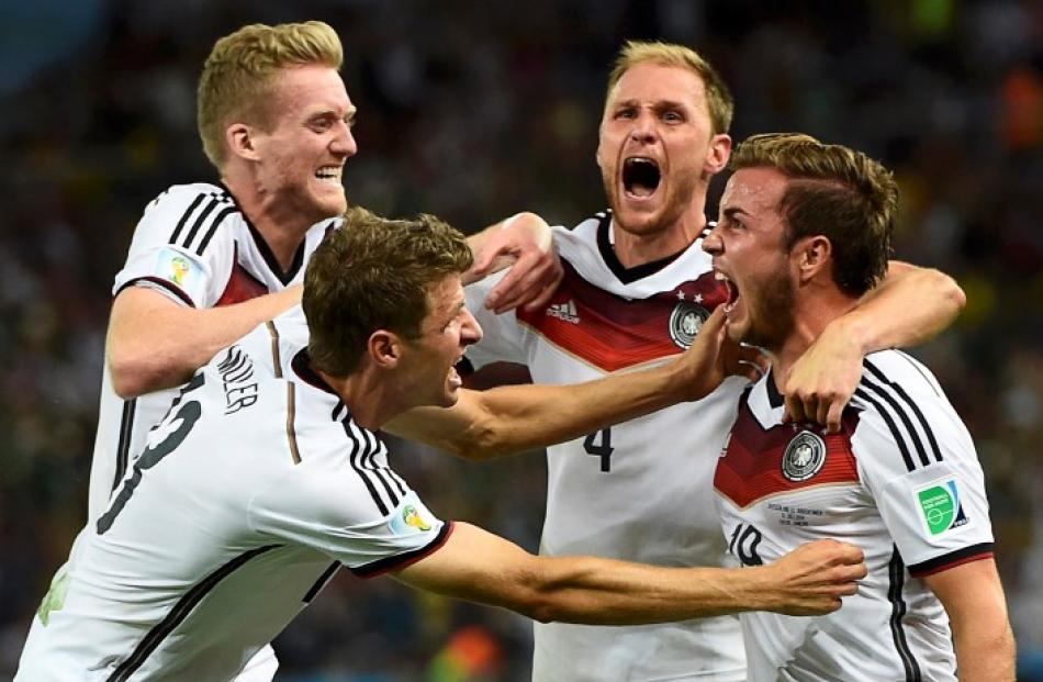 Mario Goetze celebrates his goal with teammates (L-R) Andre Schuerrle, Thomas Mueller and...