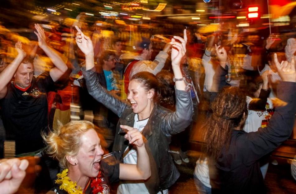 Fans celebrate Germany's win at the 'Reeperbahn' red light district in Hamburg. REUTERS/Morris...
