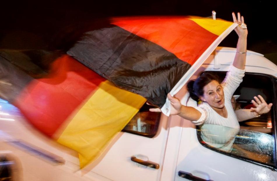 German fans celebrate as they drive along the 'Reeperbahn' in Hamburg. REUTERS/Morris Mac Matzen