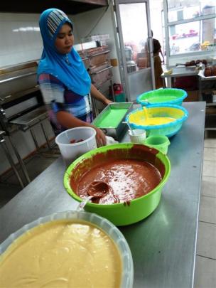 Creating the famous, egg-rich Sarawak kek lapis (layer cake) is hard work.