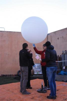 Dr  Kaifler  and  German scientists Benedikt Ehard (centre)  and Sonja Gisinger prepare a balloon...