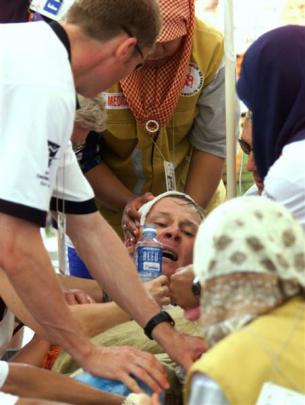 Race walker Craig Barrett is treated for exhaustion in Kuala Lumpur in 1998.