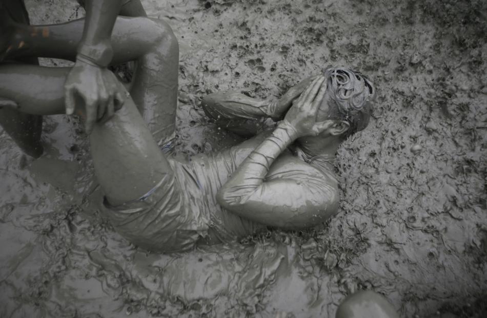 Tourists attend the Boryeong Mud Festival at Daecheon beach in Boryeong.