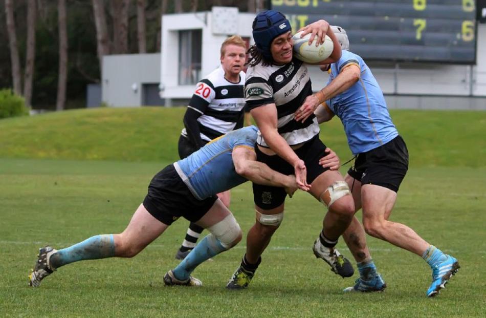 Southern flanker TJ Ioane makes a powerful charge toward the University A line.