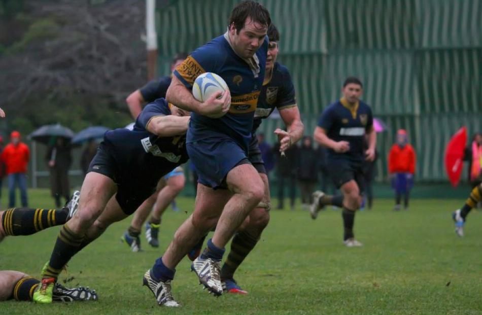 Taieri hooker Henry Parker breaks from a maul.