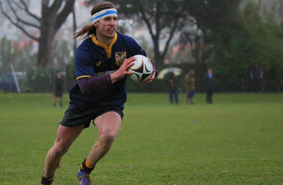 Dunedin replacement winger Sam Weber returns a kick up the sideline.