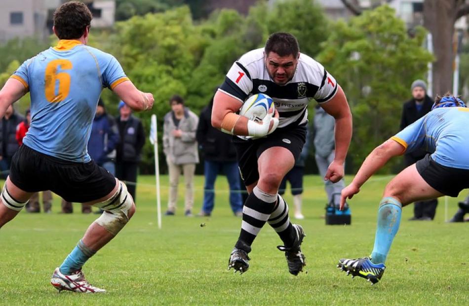 University A players Nick Connell (No 6) and Sam Sturgess prepare to tackle charging Southern...