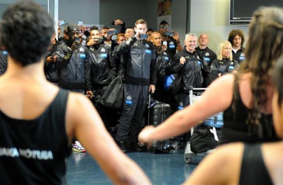 Newcastle United players film the welcome from King's and Queen's High Schools' kapa haka group...
