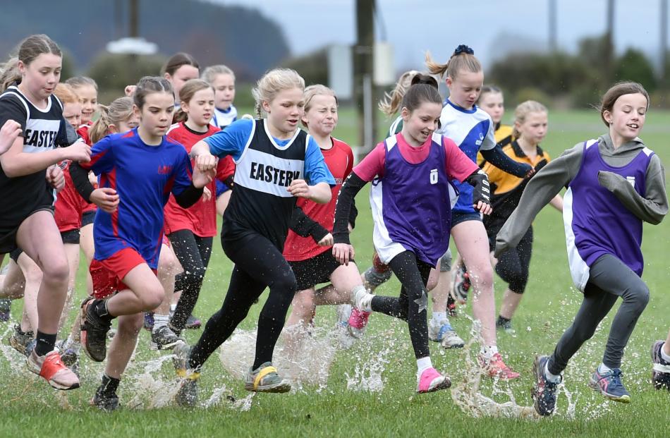 Pupils run in the 10-year-old girls race.