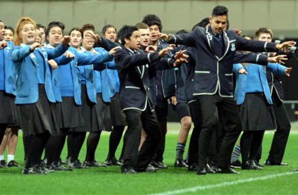 The King's and Queen's Kapa Haka group preforms.