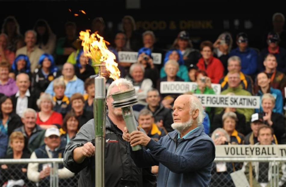 Lighting the flame at the opening of the 2012 New Zealand Masters Games at Forsyth Barr Stadium.
