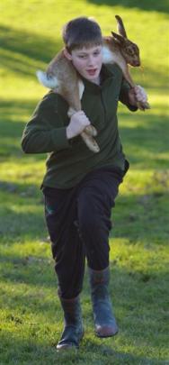 Competing in a hare-carrying contest at the Taieri College Hunting Competition weigh-in at Taieri...