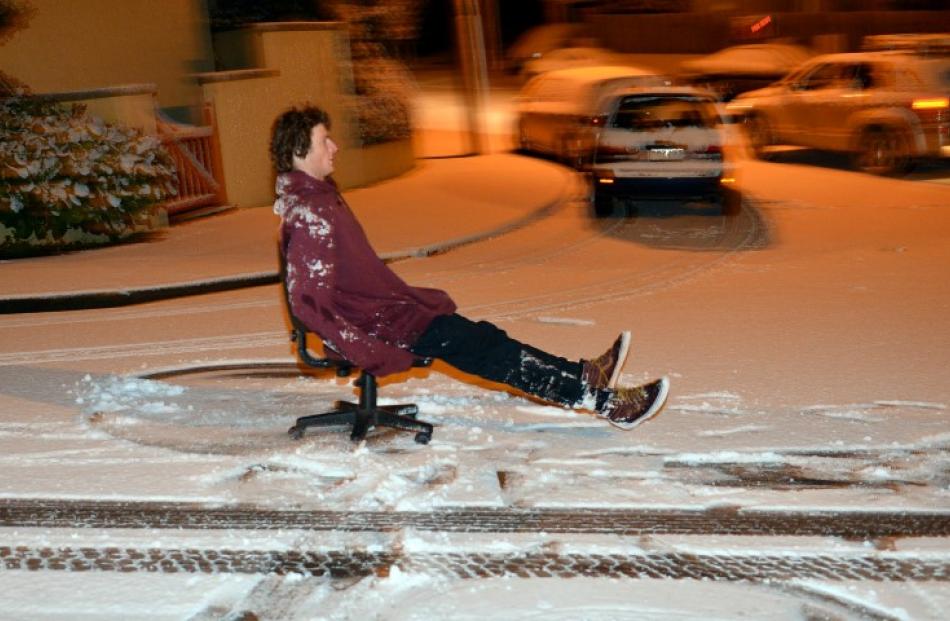 University of Otago student Jack Hunt 'rides' the powder on Pitt St.