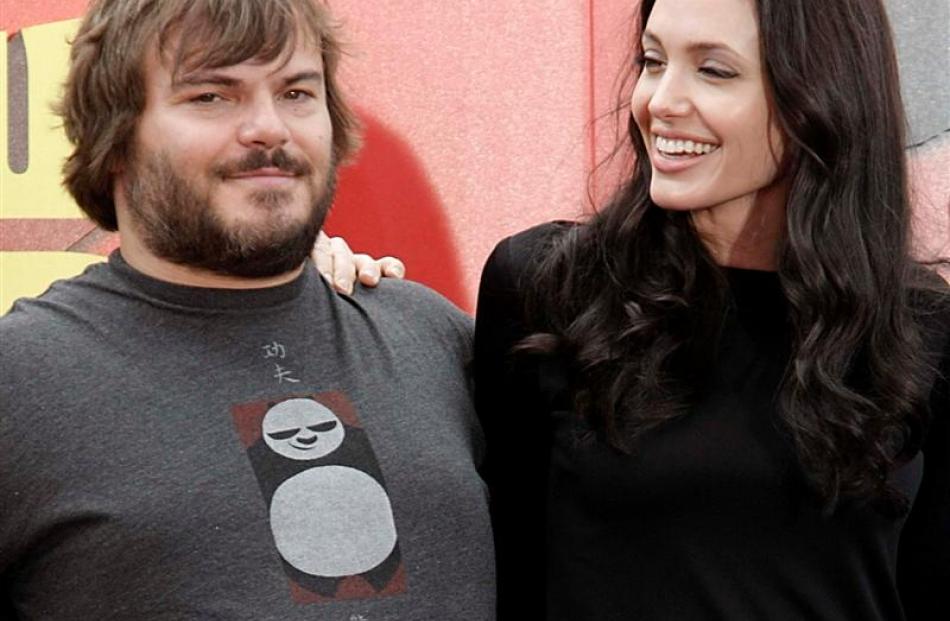 Actor Jack Black, left, and actress Angelina Jolie at the DVD release event for the animated...