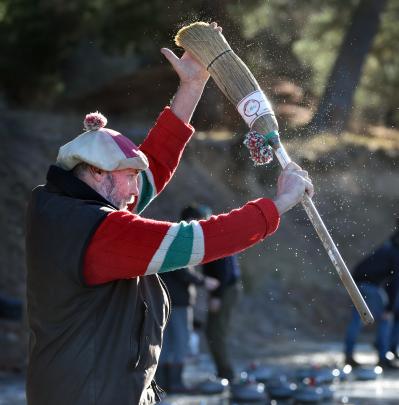 Trev Davis, of Fruitlands in Central Otago, shakes ice off his brush.