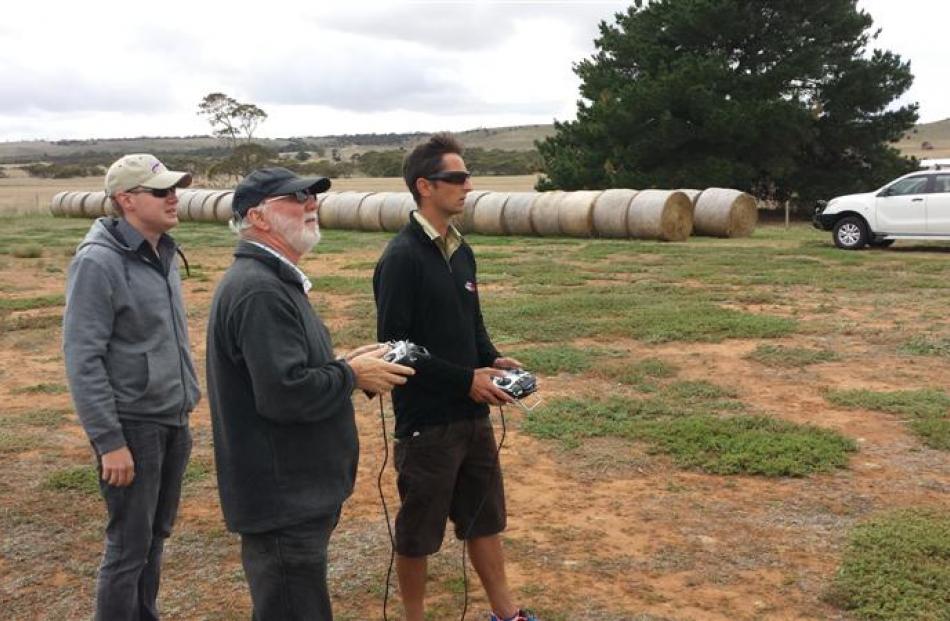 DroneMetrex representative  Ben Neale (left) watches as the company  Dave Whittle (centre) and...