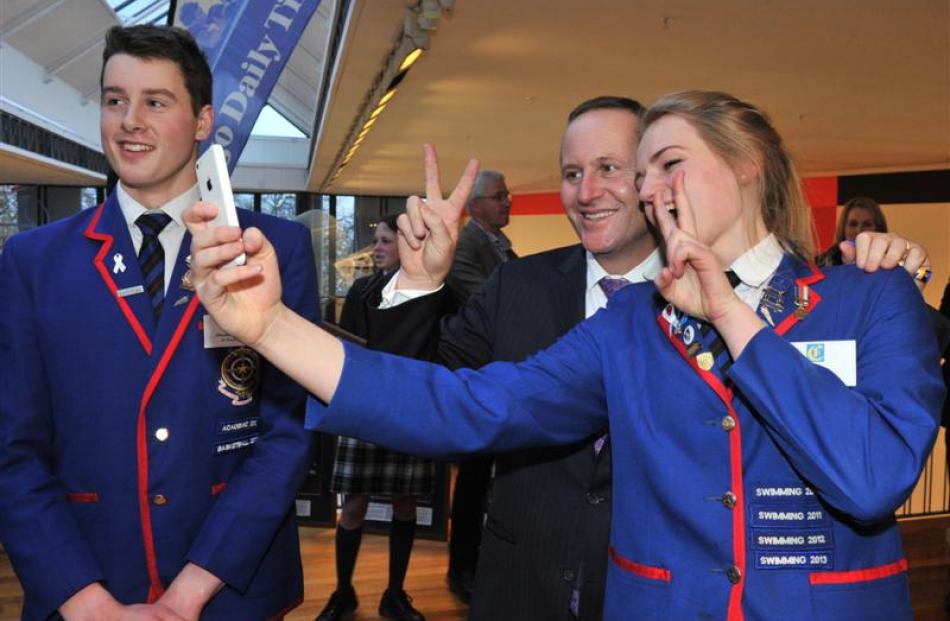 Mr Key strikes o pose with St Kevin's College pupils Christopher Kearney and Isobel Ryan. Photo...