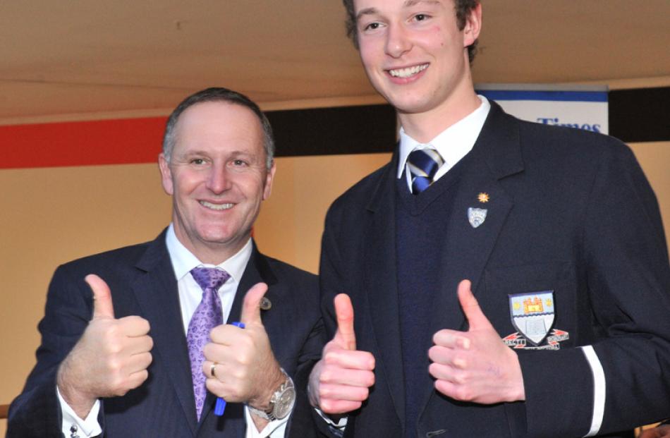 Prime Minister John Key gives the thumbs up with William Pelet of Otago Boys High School.