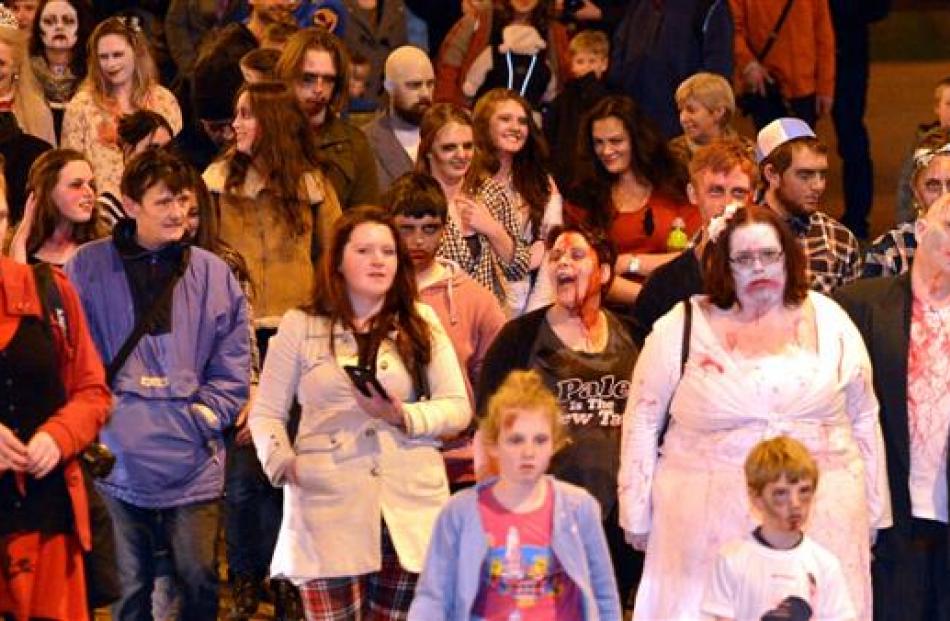 Zombies shuffle along Lower Stuart St in Dunedin.