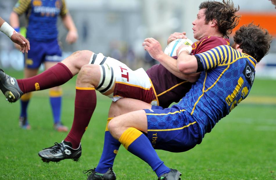 2013 - Southland's Tim Boys tackled by Otago's Kieran Moffat in the ITM Rugby Cup at Forsyth Barr...