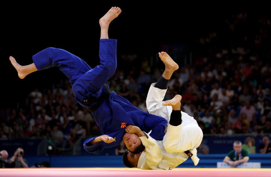 Guilherme Schimidt of Brazil and Edi Sherifovski of North Macedonia compete in the men’s judo ...