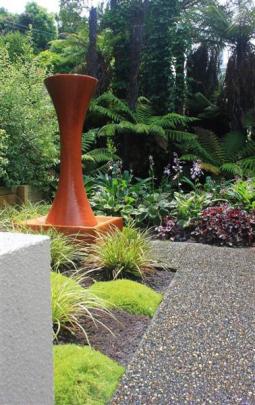 Artwork gives colour and height in the McKinney garden.