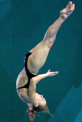 Thomas competes in the diving semifinals at the 2002 Commonwealth Games in Manchester. Photo by...