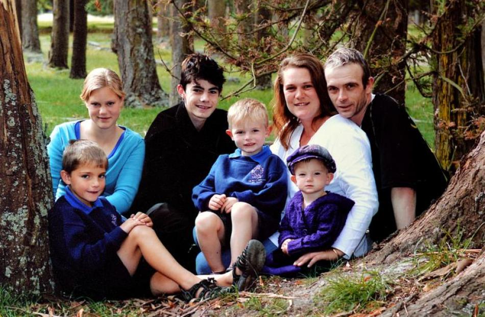 The last family photograph with his mother and stepfather, from left, George (8), Chantal (13),...