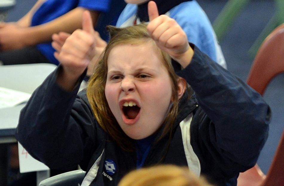 Rosa Garlick (10), of Macandrew Bay School team four, cheers on her school's second-placed team.