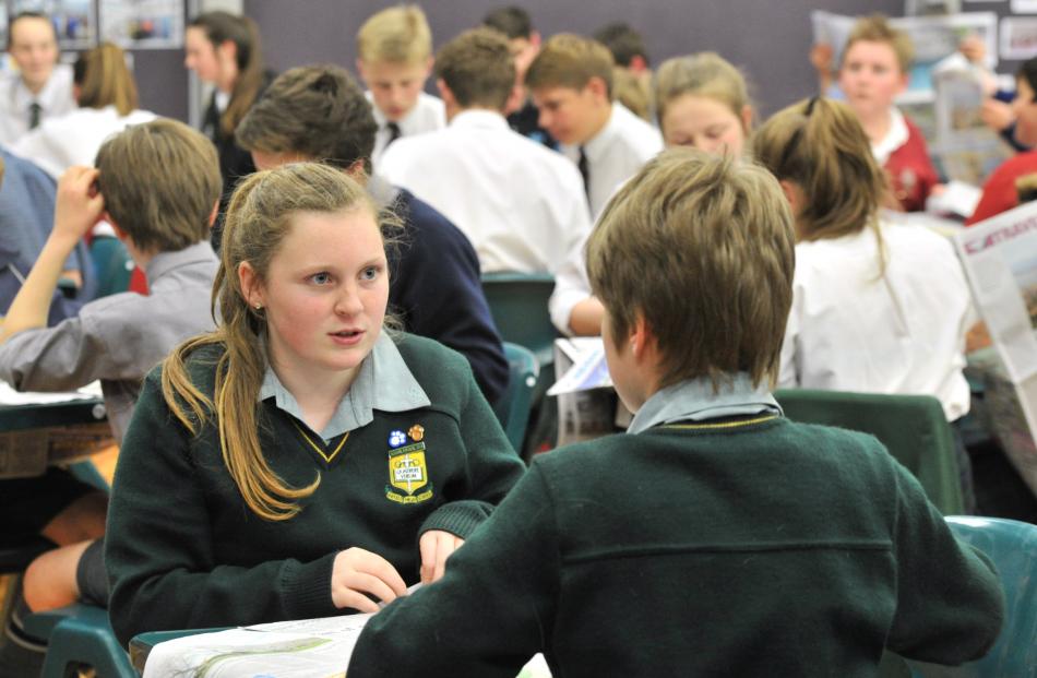 Nicole Dunford (13) checks an answer with Bayfield High School team mate Hamish Phillips (13).