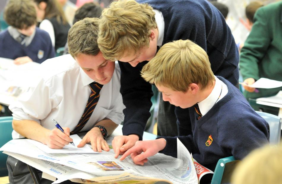 John McGlashan College pupils (from left) Mitchell Parks (15), Robert Sangster (14) and George...