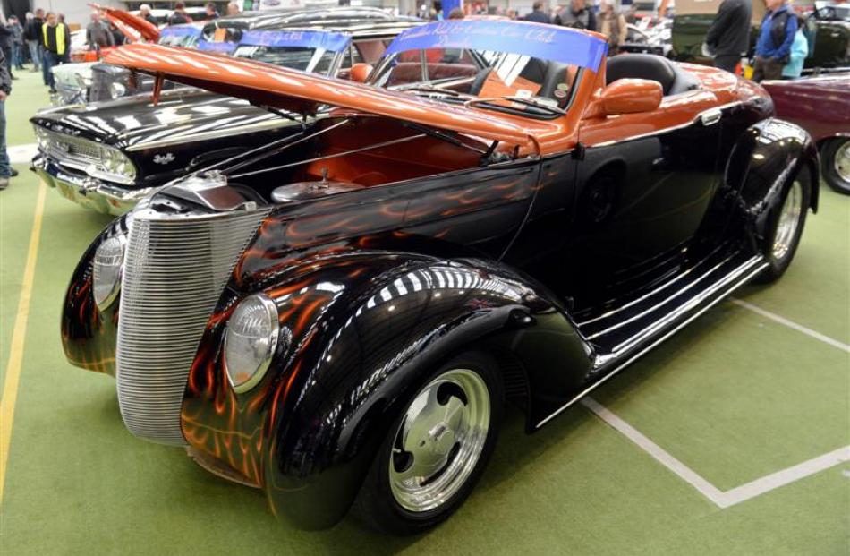 This 1937 Ford Deluxe Coupe, owned by Barry McFarlane, of Dunedin, features a ''mile-deep'' paint...