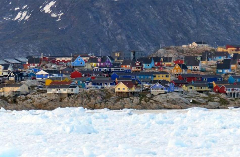 A coastal village in west Greenland, nestled between ice and rock.