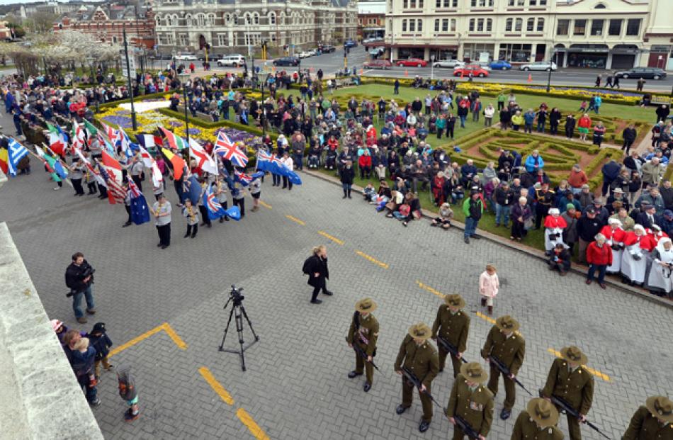 The parade arrives at the station.