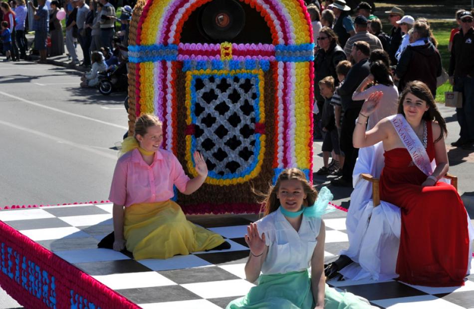 Riding the Alexandra Musical Society float "All Shook Up"  is festival princess Tayla Galletly.