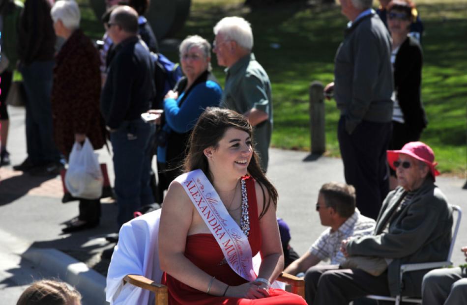 Riding the Alexandra Musical Society float "All Shook Up"  is festival princess Tayla Galletly.