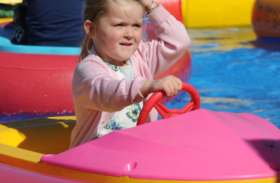 Katie Robins (4), from Orawia, splashes about in the bumper boats.