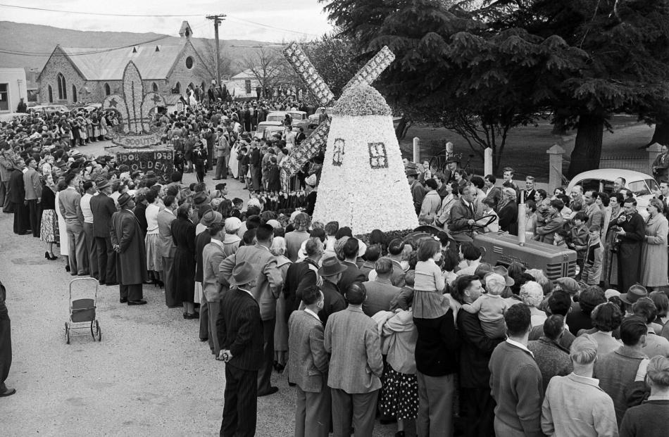Windmill land . . . A float in the parade in the second annual Alexandra Blossom Festival, in...