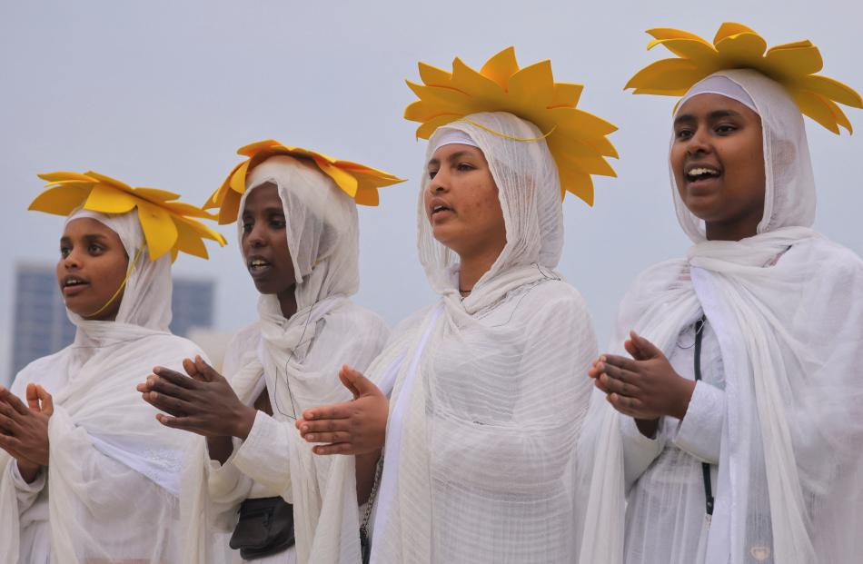 Ethiopian Orthodox choir members sing during the Meskel festival, a celebration to commemorate...