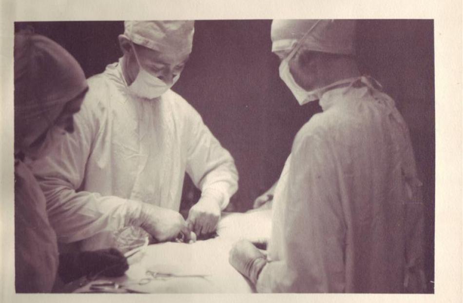 Arthur Porritt in the operating theatre. During the 1950s he was performing about 1000 operations...