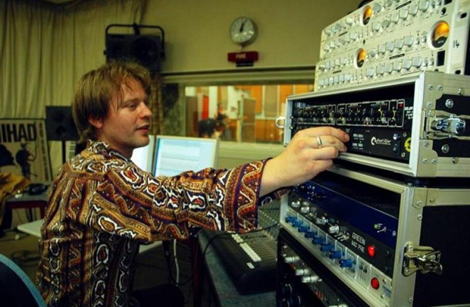 Engineer Thomas Bell on the knobs.