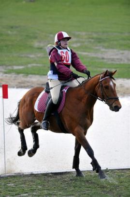 West Taieri's Karta Hewitt and Oscar come through the water obstacle unscathed.
